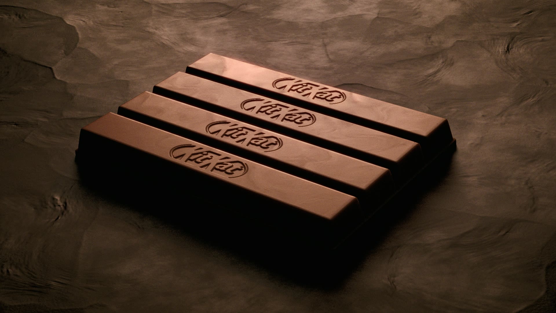 Een KitKat-reep op een stenen ondergrond.