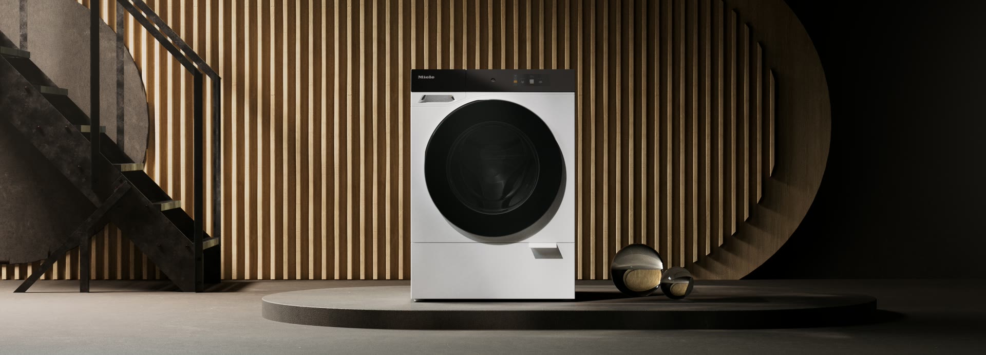 De wasmachine in een donkere ruimte met een trap.